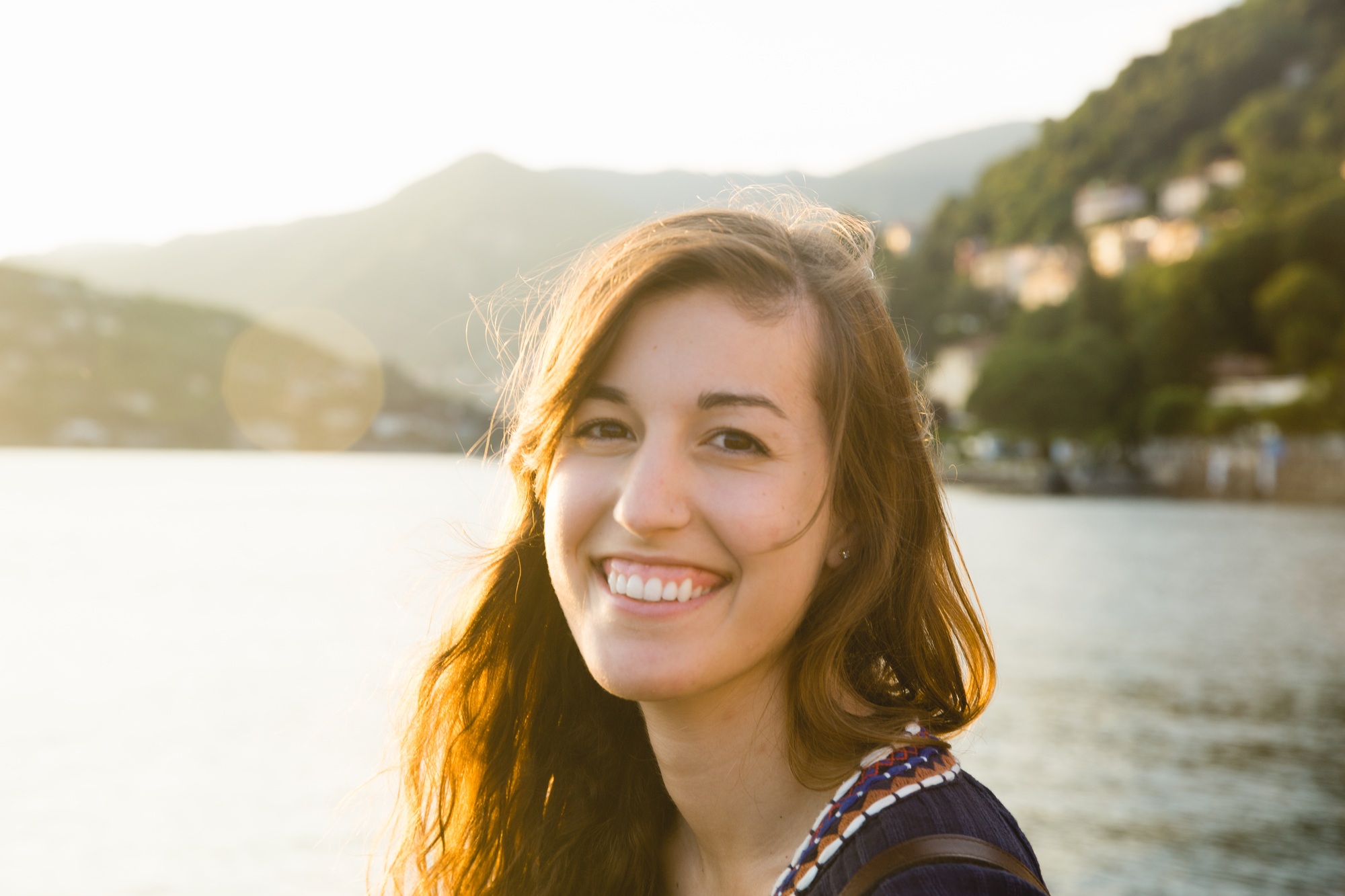 A smiling woman at Lake Como in Italy